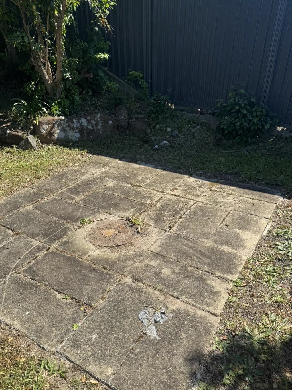Backyard pavers, before